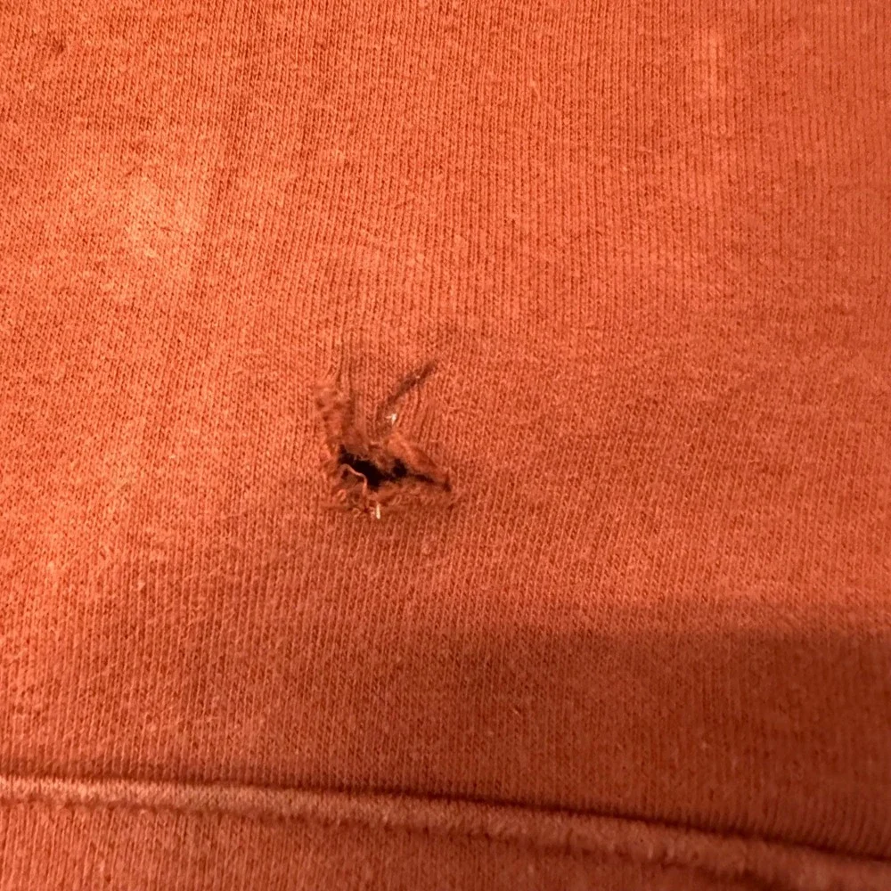 The North Face Mens Burnt Orange Logo Pullover Hoodie Size Large Distressed Hole
